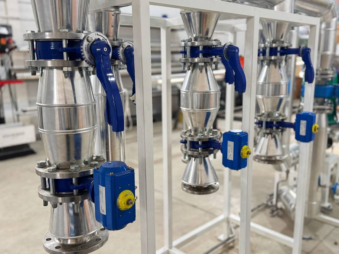Valves with blue actuators mounted on a frame
