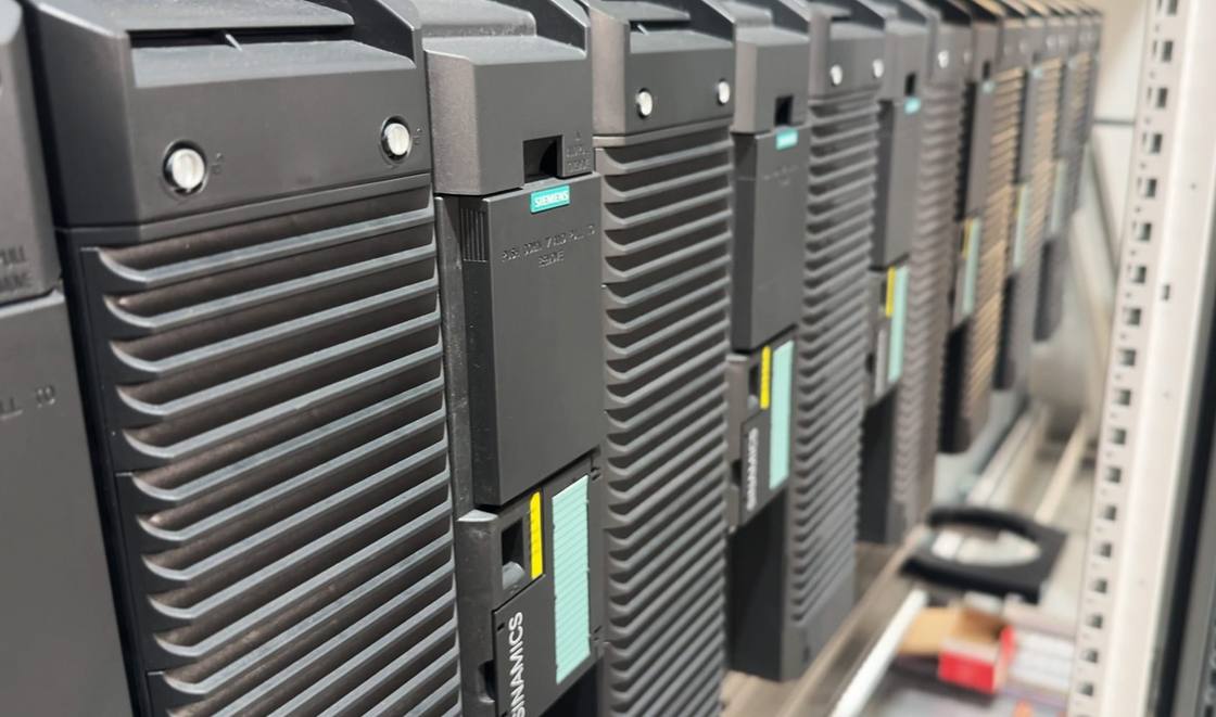 Row of Siemens drives mounted in an electrical cabinet